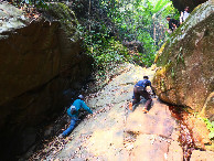 #8: Climbing a slippery rock wall with running spring water