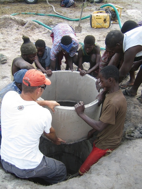 Villagers taking part in the construction of their well