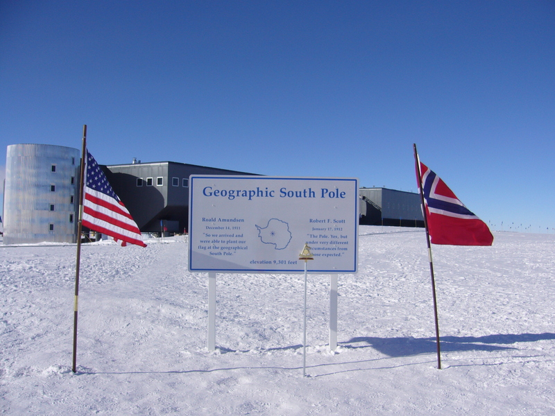 Official South Pole marker (as of 2011) and the Amundsen-Scott South Pole Station