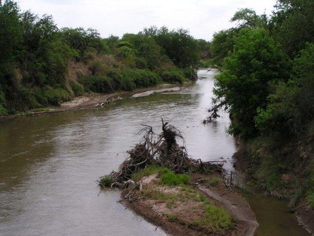 the dirt road leads over an arroyo