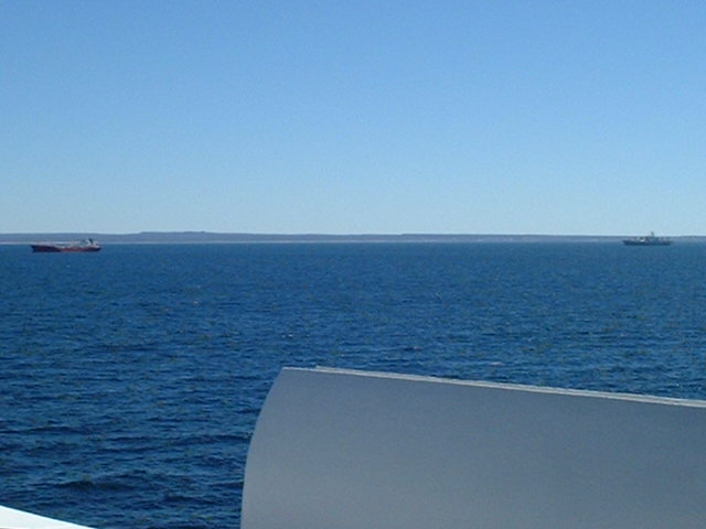 other refrigerated cargo ships awaiting berthing and loading at anchor