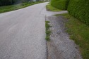 #5: The confluence point lies on a paved road, next to a road of houses