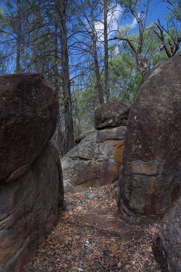 #1: The confluence point lies among large granite boulders, near the entrance to this alcove