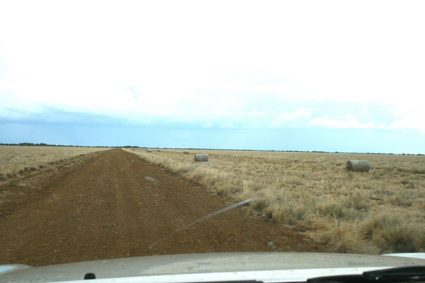 Graded track with round hay bales