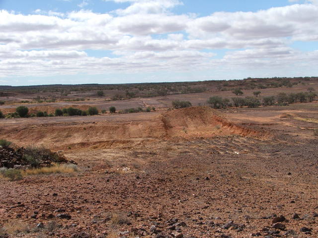 Excavations behind small rock outcrop nr confluence 23S 139E