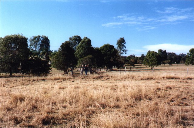 Lorette and the nice old lady, from the confluence. The Beaudesert golf course is way off across that field.