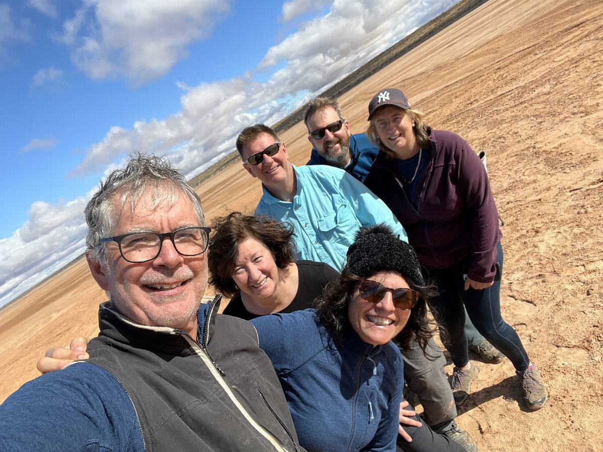 Six weary (and now dry) travellers at the confluence point