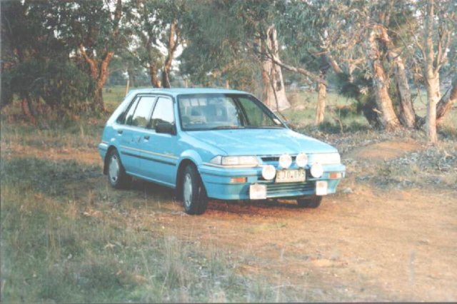 My car parked by the side of the road 100m East of the confluence.