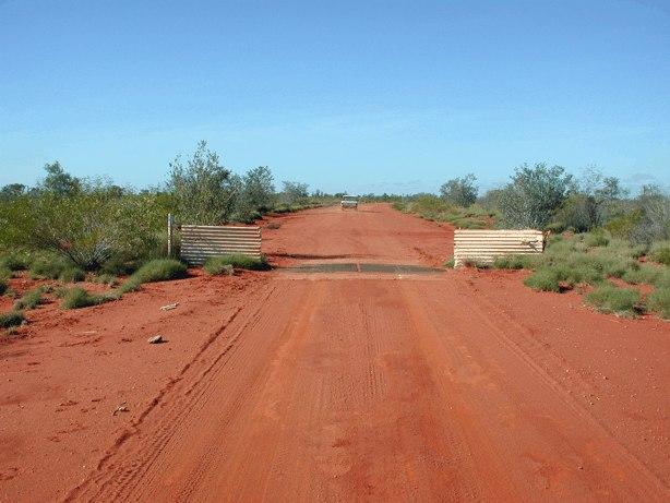 Cattle-grid on Towera Road and grey nomads off in search of a pool.