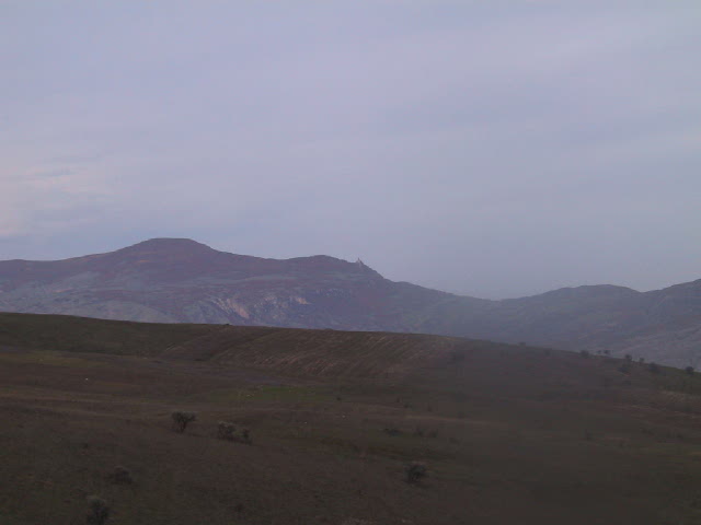 Looking N over confluence to Chirax castle