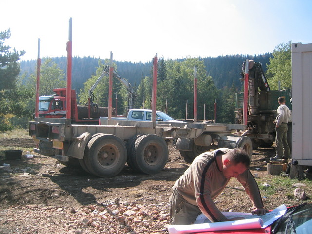 A forester studies my map of mines