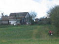 #5: Boy carrying bucket up hill