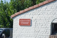 #8: A close-up of the sign on the front of the house, announcing its special status