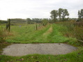 #9: Fenced area with a stonebridge in the foregound