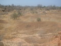 #11: Rolling red stone hills, a few kilometers from the Confluence