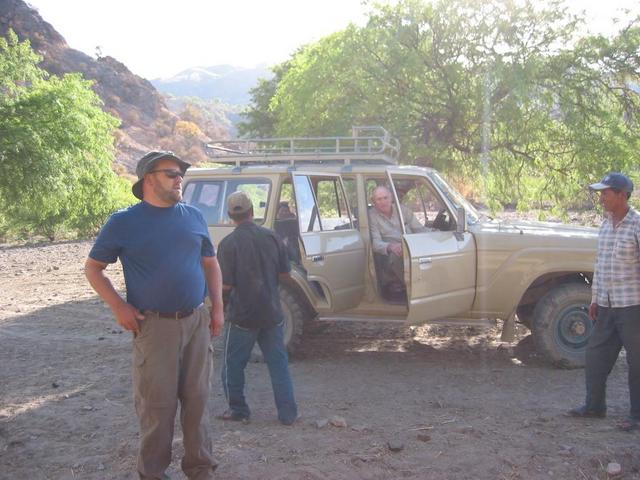 Jon and Bob (in passenger seat) getting ready to depart.  Note the locals hiding behind the car, you can see them peeking through the rear window