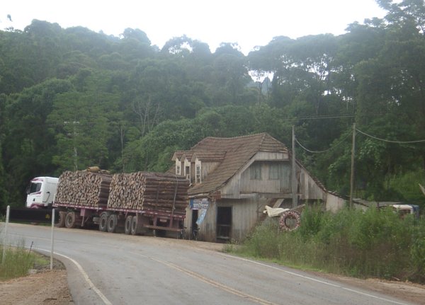 The old house (with log truck) at the turnoff to the confluence