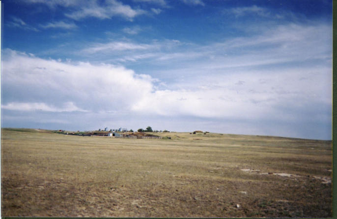 Looking east past a farmer's yard