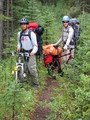 #3: Seth and Brendan on the Alexandra River bike trail, notice the long sleeves and long pants for protection from the brush.