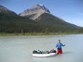 #3: Chris using the dinghy to cross the North Saskatchewan river.  Notice the water marks up to his belly button level.