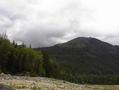 #4: Looking up to confluence from lake with burnt ridge access