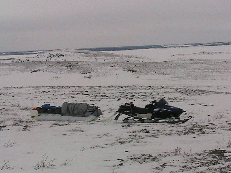 Our mode of transportation and beyond you can see a hill, It is called Beaver Lodge. The legend is that a large beaver built it and looks after the lake, and if one wishes to cross safely he must leave on the water or ice a gift of tobacco or fresh willow