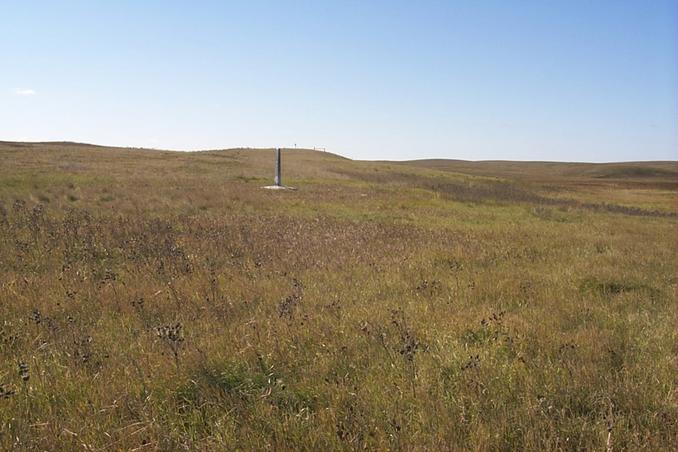 The view southwest from the confluence showing the border marker 24 meters away.