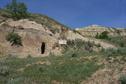 #8: Outlaw cave about 340 m from CP.  The sign reads: "Sam Kelly Caves.  House Caves and Horse Caves".