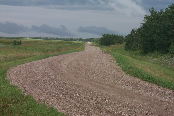 The road heading north towards our next confluence.  Will those clouds bring more rain?