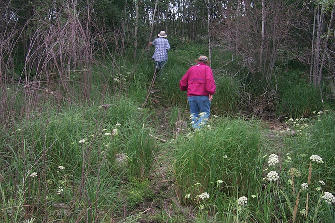 Crossing a dry but muddy creek bed.