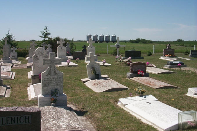A small cemetery situated directly east of the confluence. The steel grain bins in the background are the same ones seen in the view looking east.