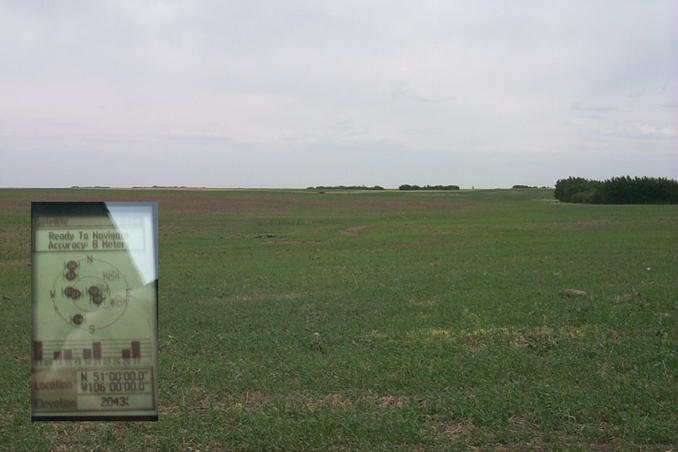 Looking east with the GPS showing the coordinates of the confluence.