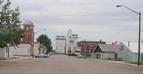 #10: Main Street in the town of Craik. The building on the left with the bell tower is dated 1913.