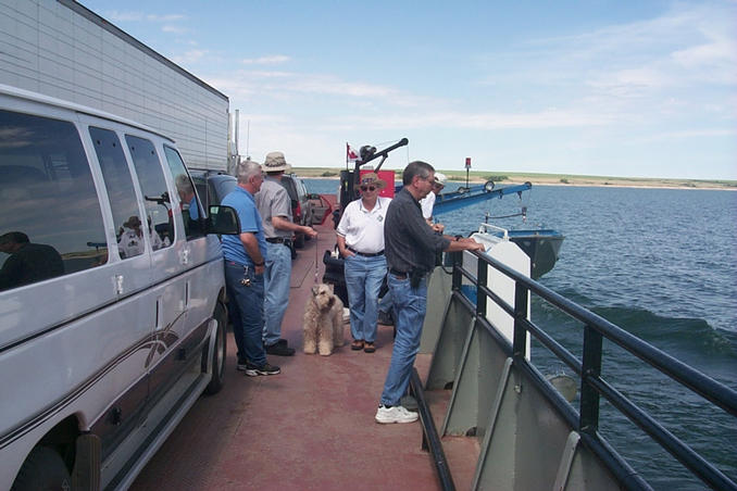 Crossing Lake Diefenbaker on the ferry with a huge transport truck blocking a good view.