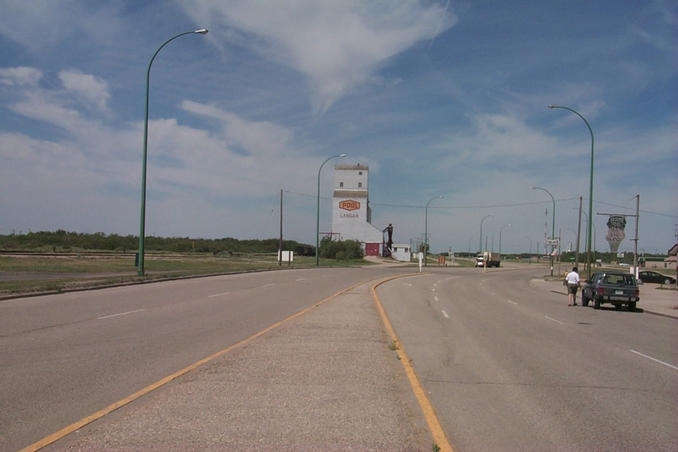 Yellowhead Highway heading west out of Lanigan past their one remaining grain elevator.