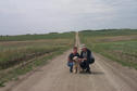 #5: Carolyn, Max and Alan withthe grid road trailing off to the west behind them.