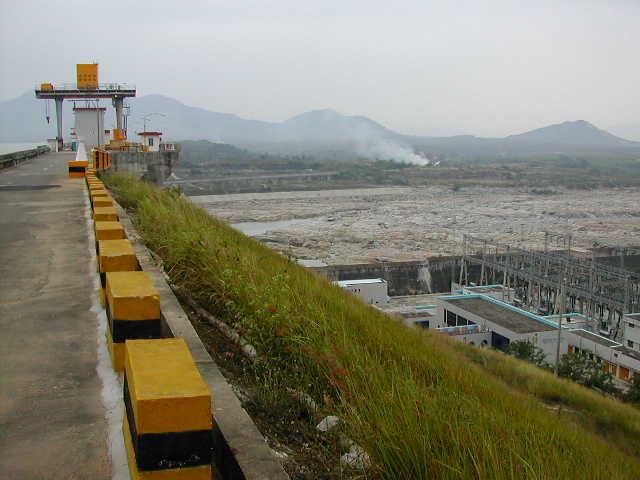 Downstream of the dam that shows the area as it might have looked before the dam was built.  Note electric substation.