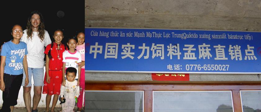 Welcoming committee posing with Targ and Sign in Mengma in both Chinese and Vietnamese