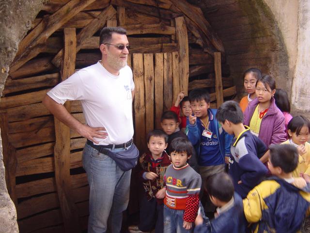 Tony (sporting his new "square" haircut) and children at the boarded up entrance to the coal mine, 380 metres northwest of the confluence