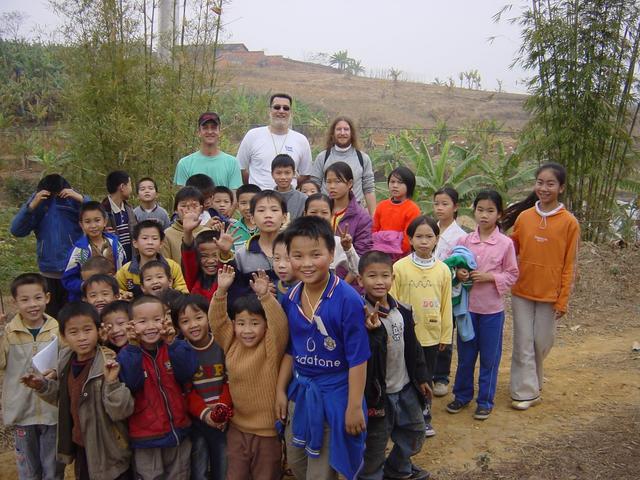 Facing north from the confluence; left to right: Richard, Tony and Targ, with the children in front