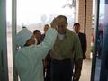 #4: Richard feigning agony upon being zapped by the SARS temperature-taking gun as he enters the Qinzhou Railway Station