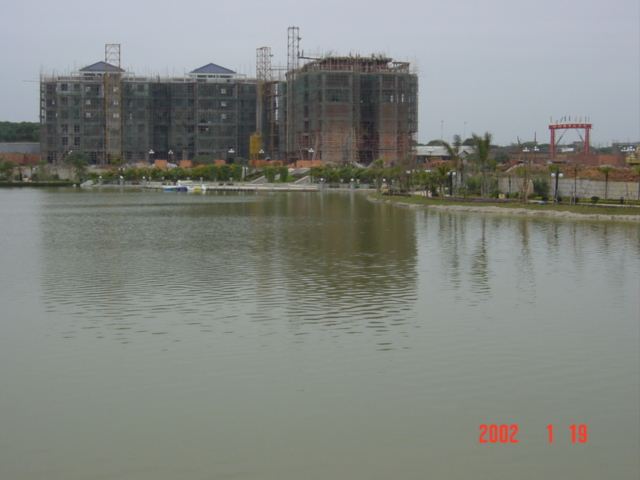 The confluence is in front of those buildings.
