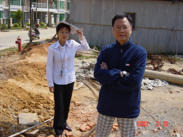 Mr Lam, the Legal Adviser, standing on the confluence point.