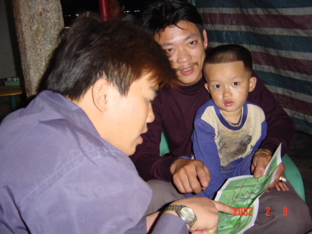 Li Chongxin (foreground) and his friend examine my map