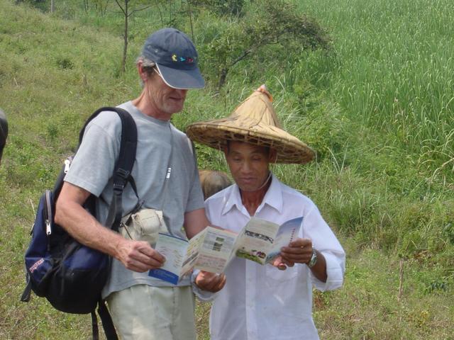 Jim gives a local farmer a leaflet outlining the KERP programme