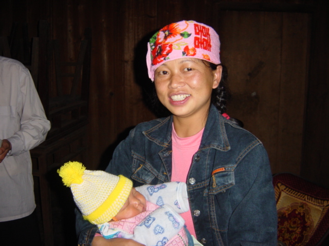 Young mother and baby, members of the Yao minority nationality