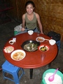 #2: Ah Feng preparing to tuck into the fried horse meat, which turned out to be as tough as old boots!
