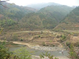 #1: General view of confluence area from 225 metres away looking southeast: Duliu River in foreground, confluence in large flat field in centre of photograph.