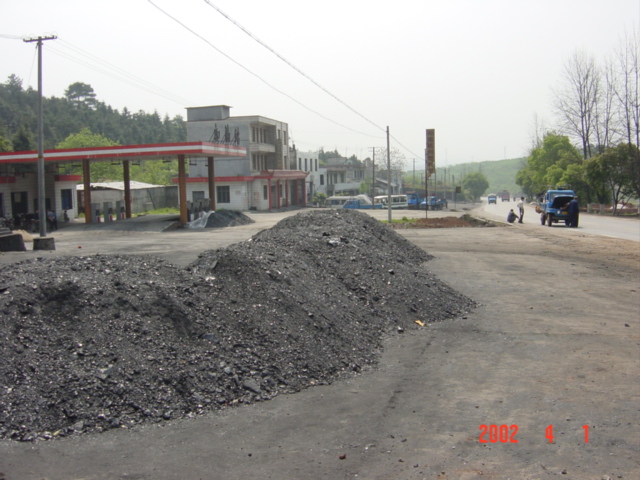 Looking south down main road, with petrol station on left