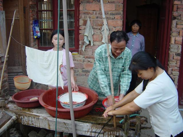 Washing hands before dinner (left to right: daughter, village chief, mother, wife)
